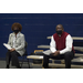 RHHA Executive Director Dewayne Alford sitting on bleachers