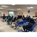 People watching a presentation in chairs. 