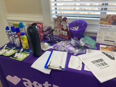 A table full of information and possible prizes for the 2025 Fall Festival.