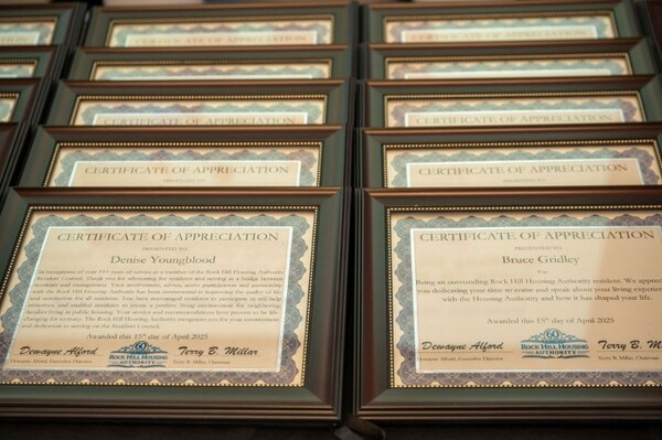 Z6A0061ADJ.jpg Rows of framed certificates.